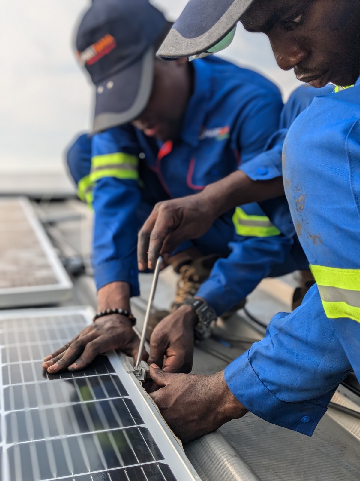 Wiring the rooftop panels, STIHL Douala