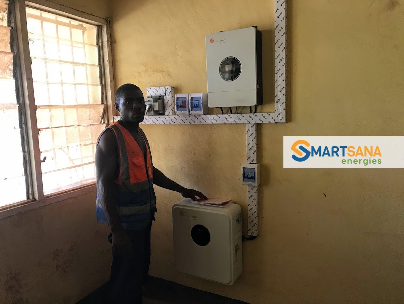 Technician presenting the system in the office, Bamenda