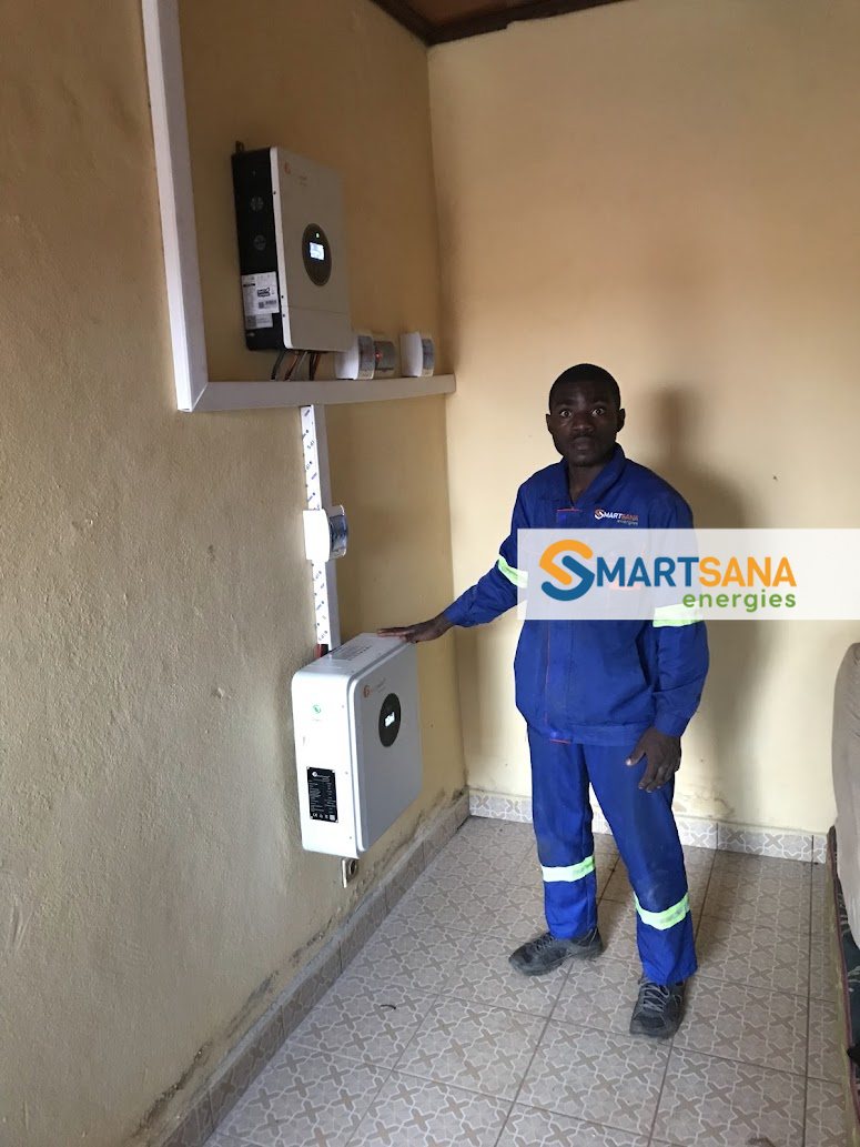 SmartSana technician beside the installed system