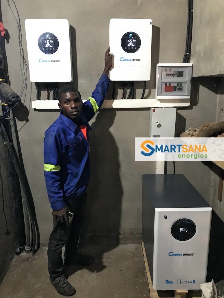 SmartSana technician checking the CWORTH Energy inverters, Mbalngong